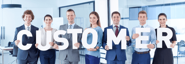 8 People Holding Letters That Spell Customer